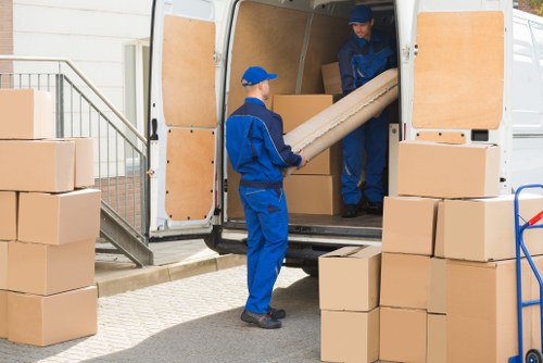 Chelsea Man with Van crew preparing van for rubbish collection